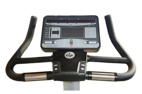 Upright exercise bike with black and gray frame, padded seat, handlebar console display, and silver base on white background