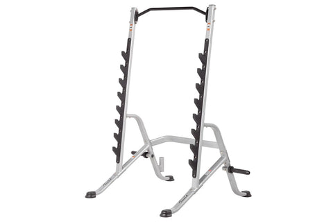 Hoist multi-purpose squat rack with silver frame, black curved top bar, and black rubber-coated dumbbell holders on vertical 