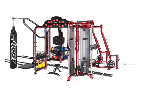 Hoist MC-7000 Series red and black multi-station gym equipment with punching bag and weights on white background