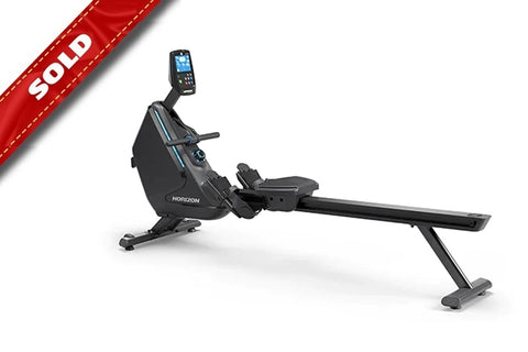 Horizon Oxford 6 black rowing machine with digital display console and extended seat track on white background, marked sold