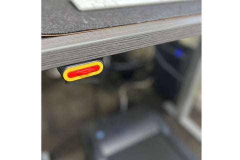 LifeSpan TR5000-Omni Desk Treadmill with black running belt, gray desktop surface, and adjustable white metal frame on white 