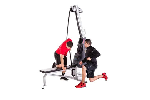 Man in red shirt using gray and black Marpo VMX 360 rope trainer machine with adjustable arm on white background