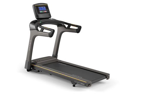 Matrix T30 treadmill with black and gray frame, digital display console, dual handles, and black running deck on white backgr