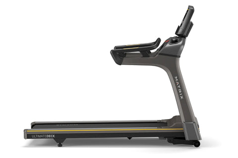 Matrix T50 treadmill with black running deck, gray frame, dual handlebar grips, and digital display console on white backgrou