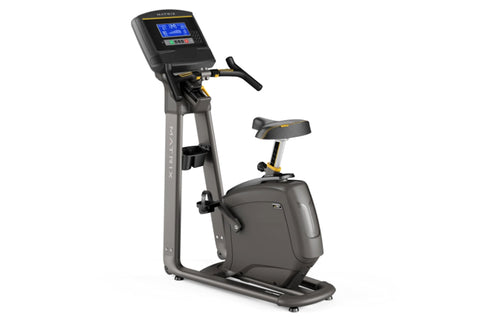 Matrix U30 upright exercise bike with black frame, digital console display, handlebars, and padded seat on white background
