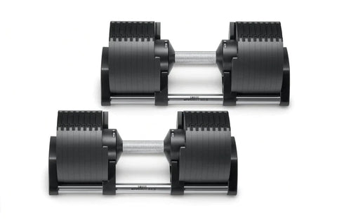 Pair of black adjustable dumbbells with ribbed rubber weight plates and silver metal handles, shown on white background