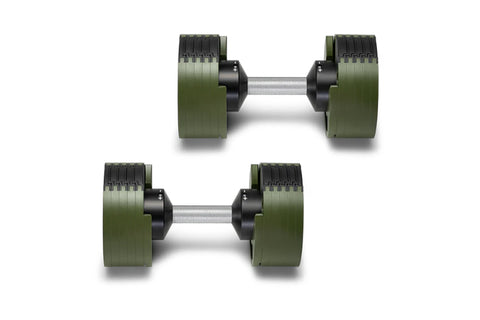 Pair of Nüobell adjustable dumbbells with olive green weight plates, black handles, and silver metal bars, shown stacked on w