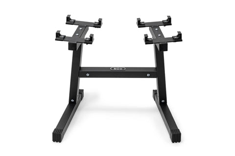 Black adjustable dumbbell stand with double legs, two horizontal arms with multiple clamps, and rubberized feet on white back