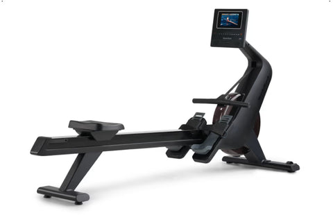 Black NordicTrack RW600 rowing machine with digital display screen and foot pedals, shown on white background