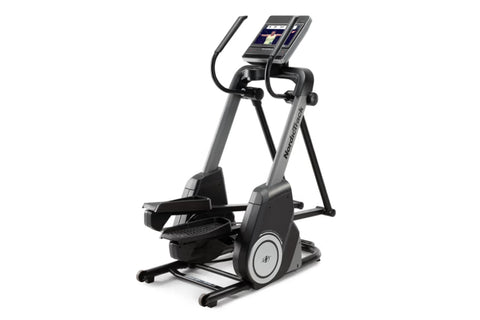 NordicTrack FS14i elliptical with gray frame, black pedals and handlebars, digital display console, and cable attachment on w