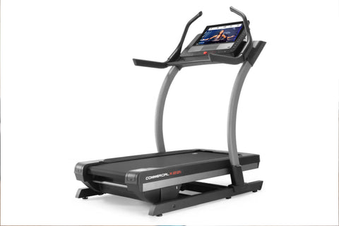 NordicTrack X22i Commercial treadmill with black belt, gray frame, dual curved handles, and touchscreen display on white back