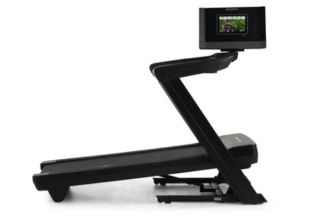 Black NordicTrack treadmill with Z-shaped frame and attached display screen showing workout video, on white background