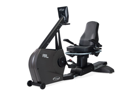Black recumbent exercise bike with padded seat, digital display console, and foot pedals on white background