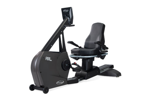 Black NuStep RB8PRO recumbent exercise bike with padded gray seat, digital display console, and rolling base on white backgro
