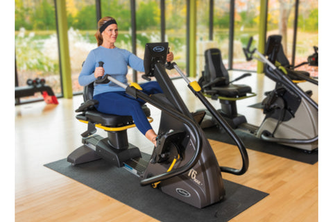 Black and yellow recumbent elliptical stepper with padded seat, handlebar controls, and footrest on white background