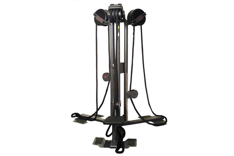 Black vertical rope trainer with dual handles and foot platform on white background