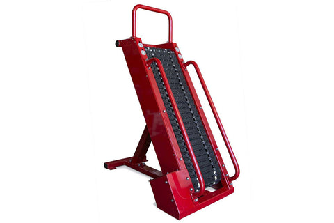 Red metal stair climbing machine with black textured tread surface and dual handles on white background