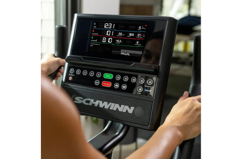 Schwinn 190 upright exercise bike with black frame, digital display console, and black padded seat on white background