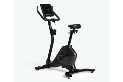 Schwinn 190 upright exercise bike with black frame, digital display console, and black padded seat on white background
