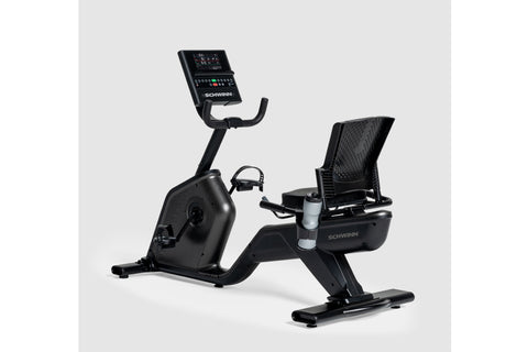 Black Schwinn 290 recumbent exercise bike with digital console, mesh backrest, and water bottle holder on white background