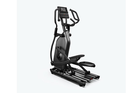 Black Schwinn 490 elliptical machine with digital console, handlebars, and foot pedals on white background