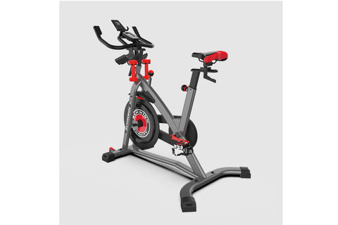 Schwinn IC4 indoor cycling bike with gray frame, red accents, and padded seat on white background