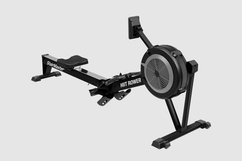A black StairMaster HIIT Rower machine, featuring a fan-based resistance system for rowing workouts.