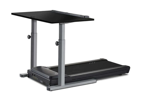 Black treadmill desk with adjustable gray metal frame and dual black work surfaces, on white background