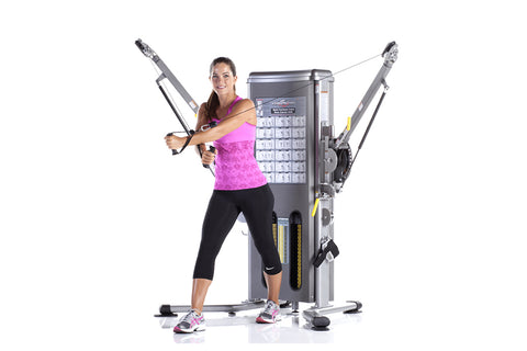 TuffStuff Evolution Dual Stack Functional Trainer with gray frame, dual adjustable arms with handles, and instruction chart o