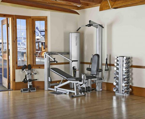 Vectra On-Line 1450 home gym with silver steel frame, black padded seat and backrest, multiple exercise stations, on white ba