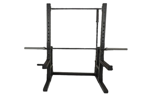 Black steel squat rack with adjustable bar positions and safety arms on white background