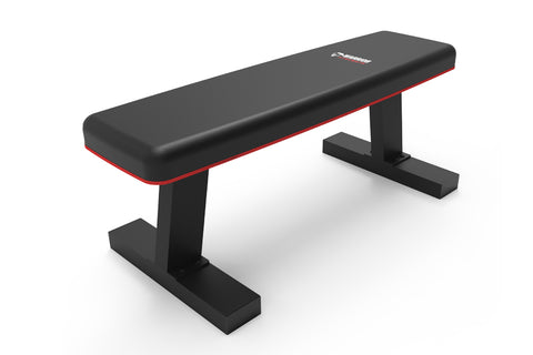 Black and red flat weight bench with padded seat, sturdy black frame base, on white background