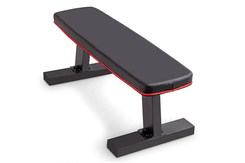 Black and red flat weight bench with padded seat, adjustable backrest, and sturdy black metal frame on white background