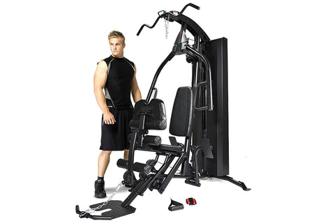 Black Warrior HG500 home gym machine with leg press, seated chest press, and attached resistance bands on white background