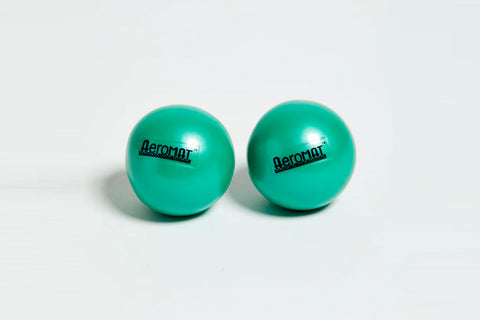 Pair of turquoise Aeromat mini weight balls with black branding, on white background