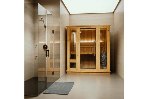 Light wood indoor sauna with glass door, wooden benches, bucket and ladle, on white background
