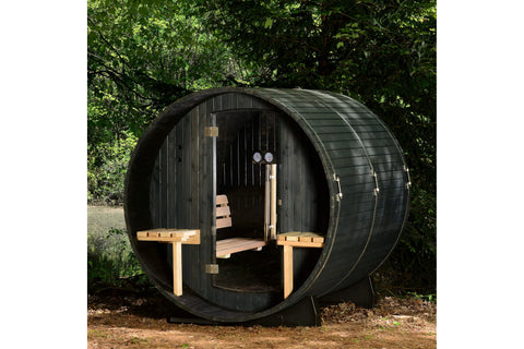Cylindrical wooden barrel sauna with hinged cedar door, interior wooden benches, and glass window on white background