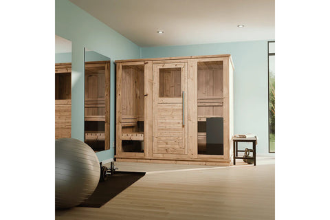Natural wood indoor sauna cabin with glass door, wooden benches, and stone heater base, on white background