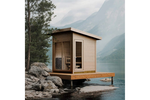 Natural wood outdoor sauna with glass doors and windows, wooden interior benches, and pitched roof on white background