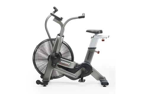 Assault Elite air bike with large black fan wheel, gray and black frame, upright seat, dual handlebars, and digital display o