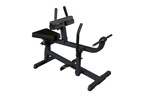 Black seated calf raise machine with padded seat, adjustable backrest, dual vertical handles with grips, and angled foot plat