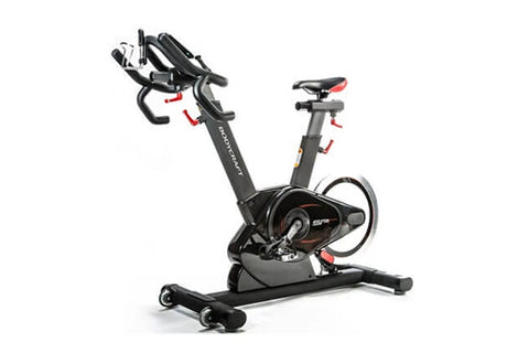 Black and gray stationary exercise bike with curved handlebars, adjustable seat, and resistance wheel on white background