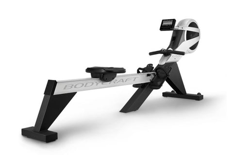 BodyCraft VR500 Pro rowing machine with white and black frame, black foot pedals, and digital display console on white backgr