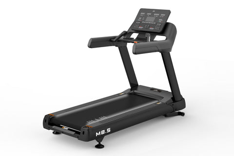 Black M8.5 motorized treadmill with digital control console, padded handlebars, and running deck on white background