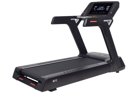 Black M12 treadmill with digital display console, orange accent trim, and cushioned running deck on white background