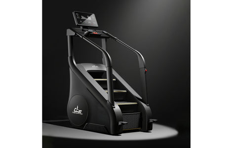 Black and gray commercial stair climber with digital display screen, handrails, and yellow-trimmed steps on white background