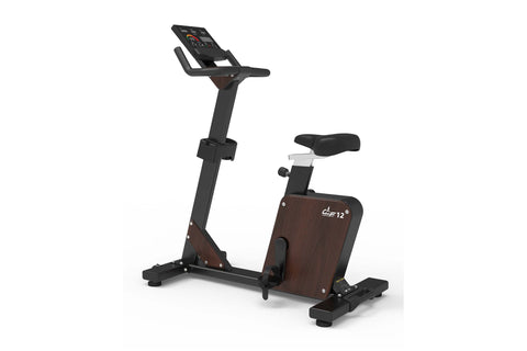 Black and brown upright exercise bike with digital display console, padded seat, and foot pedals on white background