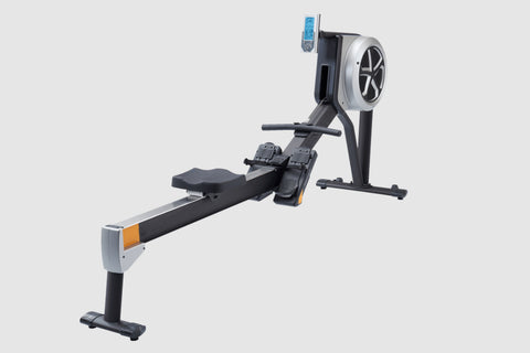 Black and white hybrid rowing machine with large fan wheel, extended seat rail, and foot pedals on white background