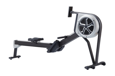 Black and white hybrid rowing machine with large fan wheel, extended seat rail, and foot pedals on white background