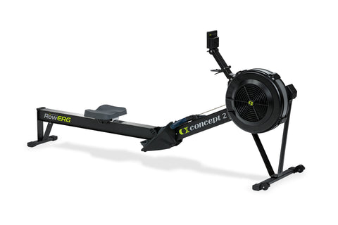 Black Concept2 RowErg indoor rowing machine with dual black resistance fans, extended arm, and stabilizing legs on white back